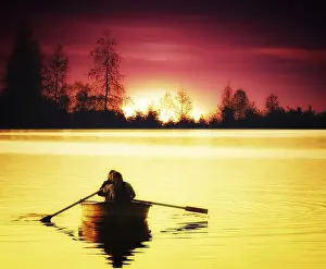 Atmospheric Evening Light Shot Drucke: Boat at Sunset
