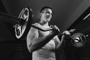Weight Training Exercise Routine Drucke: Bodybuilder Working Out Biceps - Dumbbell Concentration Curls