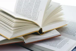 White Studio Background Photography Drucke: Books lying open on a white background