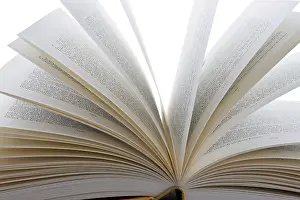 White Background Books Drucke: Books lying open on a white background