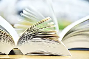 Christian Scripture Photos Drucke: Books lying on the table in the public library