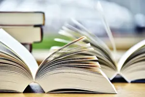 Christian Scripture Photos Drucke: Books lying on the table in the public library