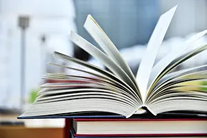Christian Scripture Photos Drucke: Books lying on the table in the public library
