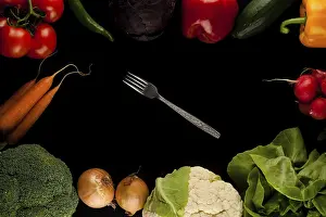 Nutrition Food Image Drucke: Border made of different vegetables with fork in the middle on black background