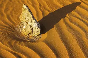 Western Asia Desert Landscapes Drucke: Boulders surrounded by wind-blown sand structures