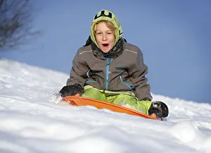 Winter Activity Drucke: Boy, 11 years, sledging