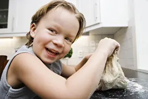Childhood Happiness Drucke: Boy baking - dough