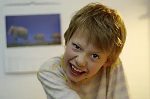 Smiling Child Drucke: Boy being cheeky