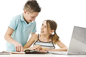 School Homework Help Drucke: Boy and girl learning together with a computer