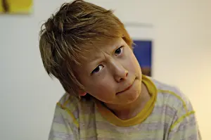 Facial Expression Of A Child Drucke: Boy looking tense