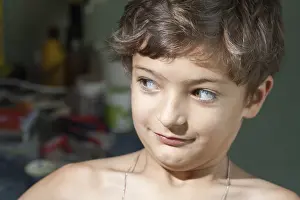 Young Boy Portrait Drucke: Boy make faces and looking away
