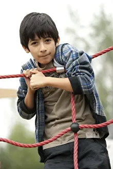 Daytime Leisure Activity Drucke: Boy on a playing ground