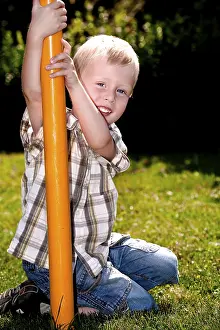 Caucasian Boy Smiling Drucke: Boy playing on the playground