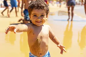 Atlantic Ocean Coastline Scene Drucke: Boy playing in the sand and having fun