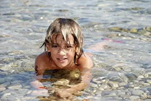 Holiday Resort Photography Drucke: Boy at seashore