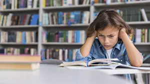 Educational System Drucke: Boy thinking hard about how solve his homework with