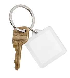 Bright White Background Images Drucke: A brass house key and a square keychain on a ring