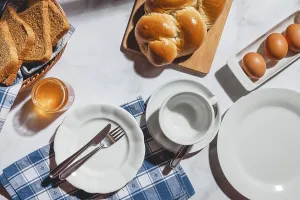 Deserted Breakfast Table Setting Drucke: Breakfast items such as toast, stollen