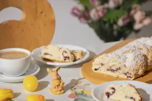 Traditional Easter Meal Ideas Drucke: Breakfast table with coffee, sliced yeast braid and decoration for Easter
