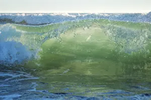 Portugal Beach Scene Drucke: Breaking ocean wave on sunset backlit with sun