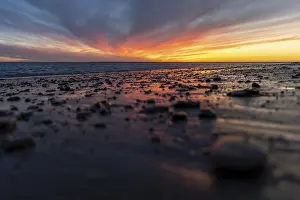Evening Sun In Spain Drucke: A breathtaking sunset on the beach