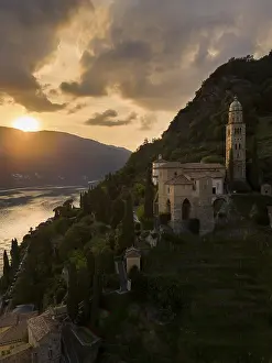 Church Architecture In Europe Drucke: A breathtaking sunset over Morcote