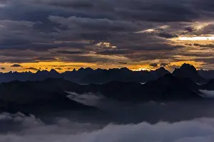 Mountainous Rural Landscape Drucke: Bregenzerwald mountains with clouds below