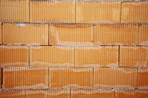 Brick Wall Background Drucke: Brick wall of a building shell