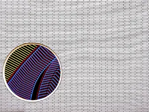 Germany Travel Photography Drucke: Part of a brick wall with a circular mosaic