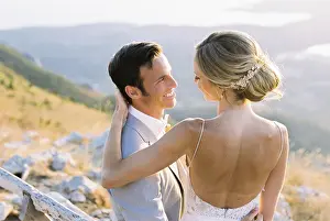 Caucasian Ethnicity Wedding Drucke: Bride sits on the lap of groom