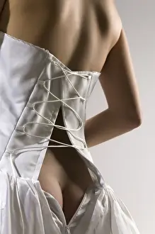 Celebrating Love And Togetherness Drucke: The bride has unbuttoned a corset and bare back