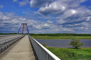 Central Europe Landscape Image Drucke: Bridge over a river under a cloudy blue sky