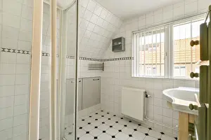 European Modern Architecture Style Drucke: A bright, modern bathroom featuring elegant tile work