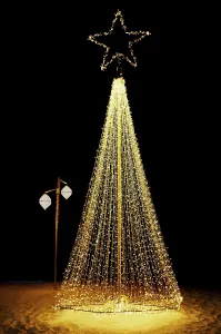 Advent Season Decorations Ideas Drucke: Bright shiny christmas tree made from string lights on sandy beach