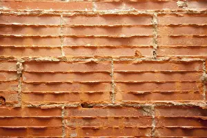 Deserted Concrete Structure Drucke: Broken bricks in brickwall in wall restoration construction