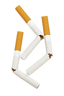 Broken Cigarette Drucke: Three broken cigarette on a white background