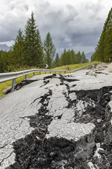 Deserted Mountain Roads Drucke: Broken road with cracks in the road surface