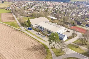 Black Forest Landscape Photo Drucke: Building complex on the outskirts of town with adjacent fields and trees