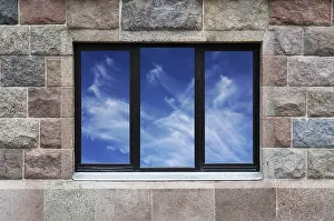Deserted Building Scene Drucke: In a building wall from large granite blocks there is a window