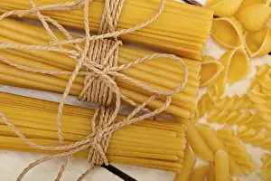Abstract Pasta Art Drucke: Bunch of Italian pasta type on a white rustic table
