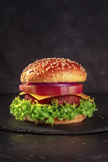 Cheeseburger Photography Drucke: Burger on black with copy space