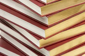 Empty Library Shelves Drucke: Burgundy covered stack of books close up