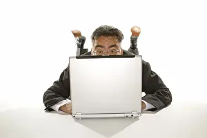 Communication Skills At Work Drucke: Business man looking up from behind a notebook