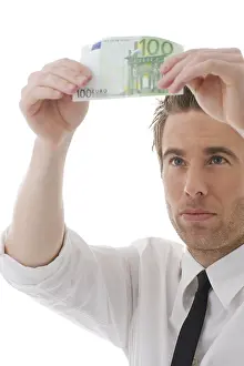 Business Finance Concept Image Drucke: Businessman checking a banknote