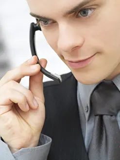 Businessman On Phone Drucke: Businessman using a headset