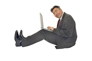 Boss At Work Drucke: Businessman working with his notebook
