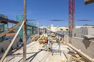 Urban Architecture Design Drucke: A bustling construction site with timber