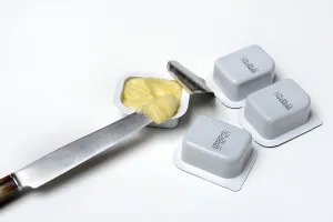 White Studio Background Food Images Drucke: Butter in breakfast portion, portion pack