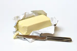 Butter Packaging Drucke: Butter with opened package and knife