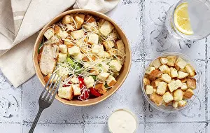 Natural Light Drucke: Caesar salad in a paper container